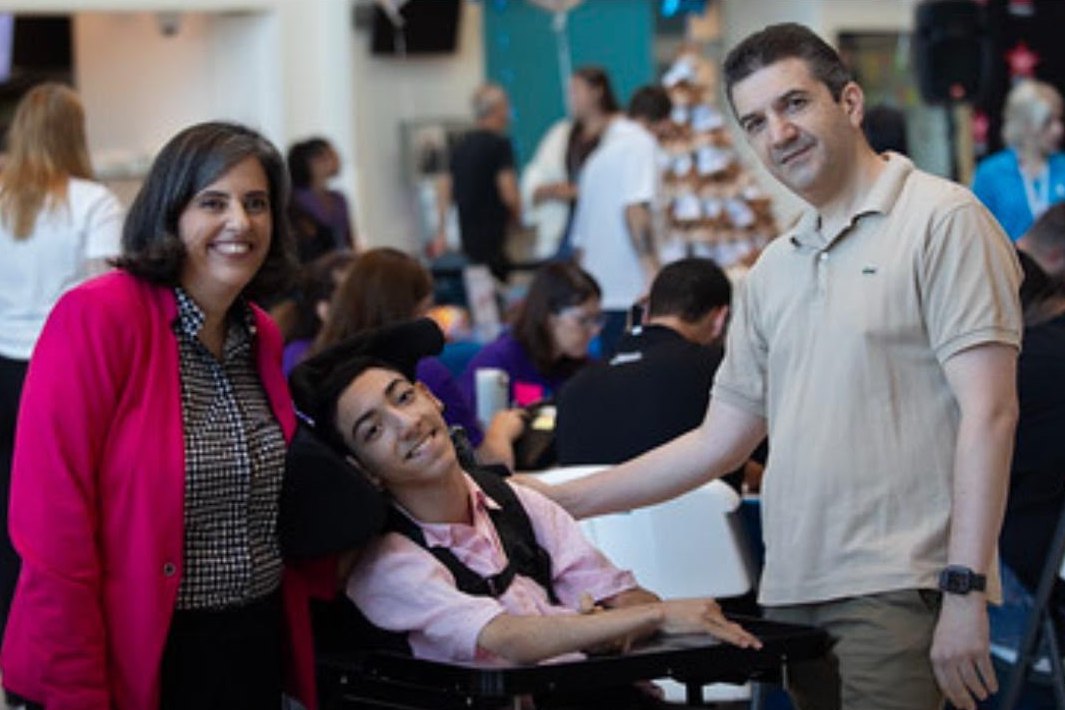 Caline Saleh and her son Fadi, with a man beside them, at the Caring for Kids Radiothon.