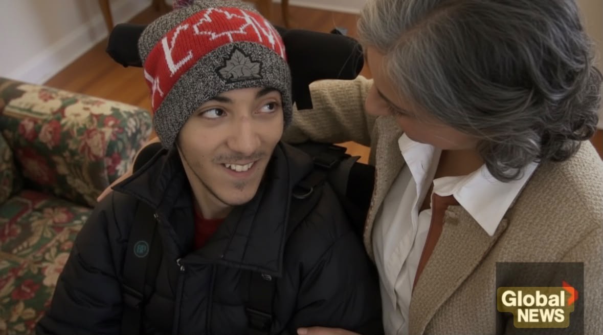Caline Saleh beside her son during the Global News Montreal report.